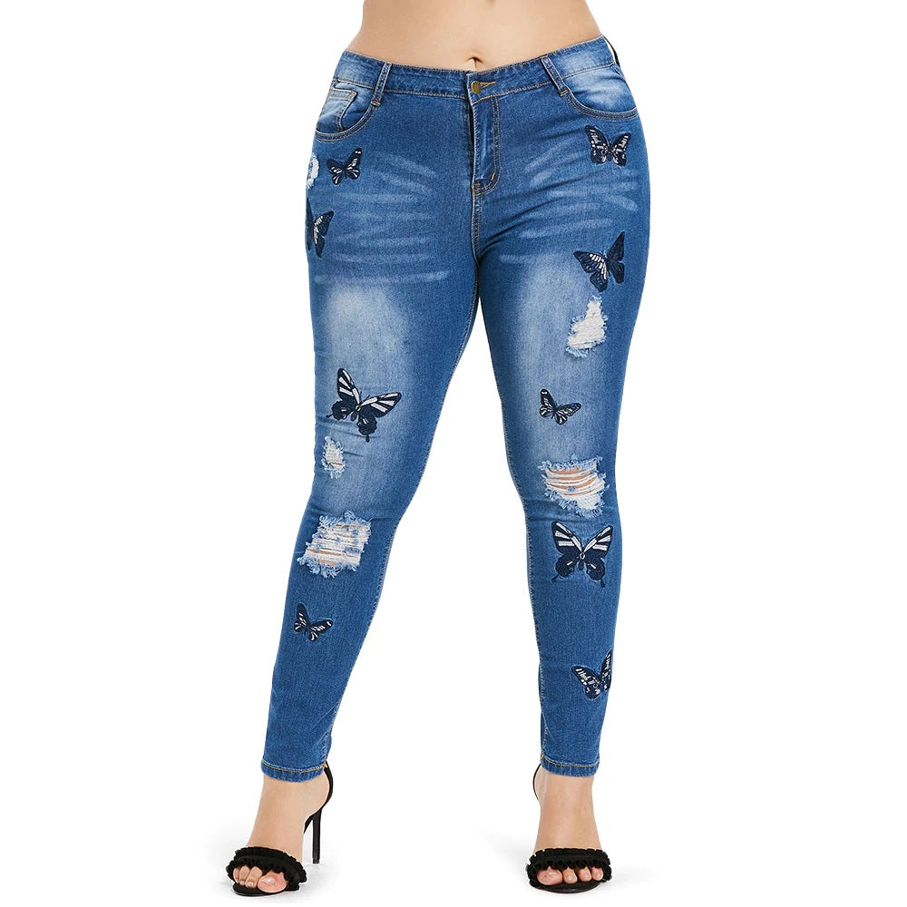 Jeans bordados desgastados con estampado de mariposas talla grande